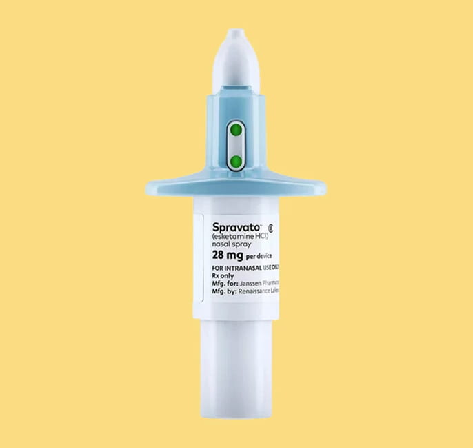 Spravato (esketamine HCl) nasal spray, 28 mg, on a yellow background